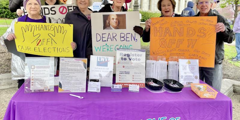 LWVCDC members at League table at Hands-Off Rally May 2025