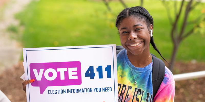 VOTE411 aids voters in self-educating before voting picture of student learning about VOTE411 voter tool