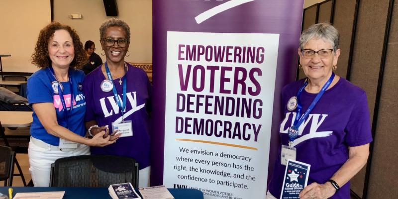 HHI trio with mission banner