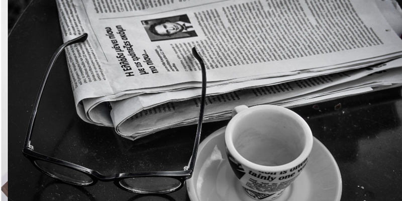 Newspaper and cup