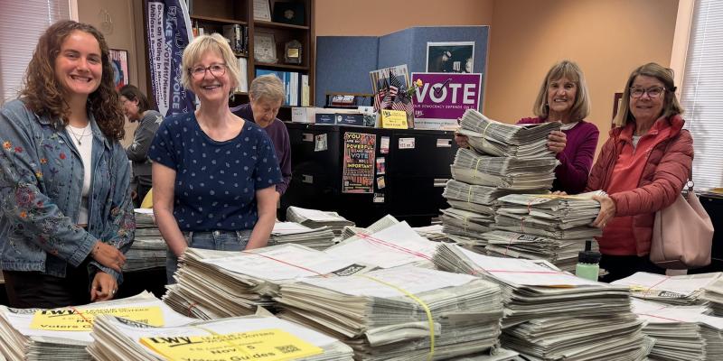 Volunteers package more than 10,000 guides for distribution