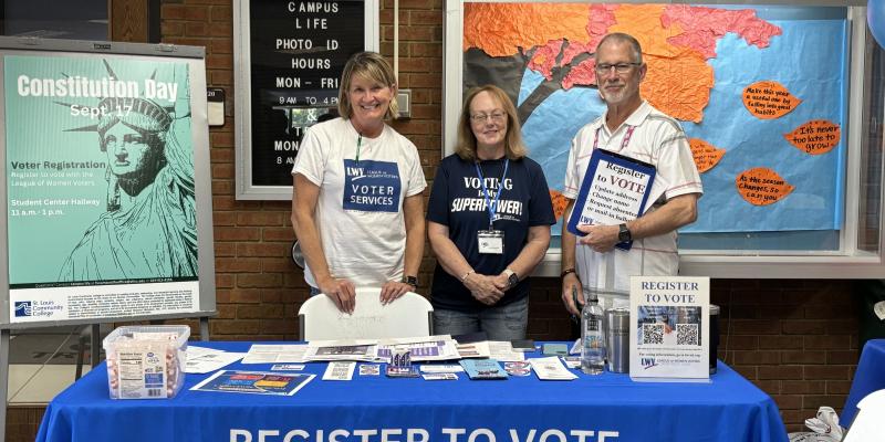 Members register students on a college campus