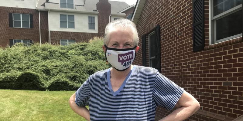 member wearing a vote411 face mask