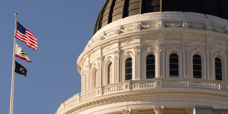 USA flag over Capitol Bldg