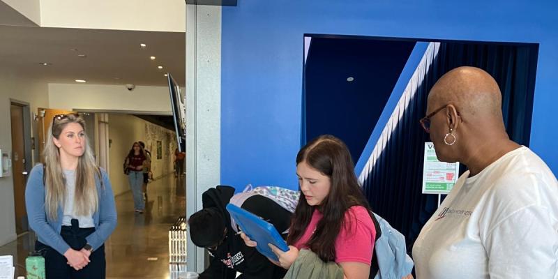 Young people register to vote during a LWVPC voter registration drive