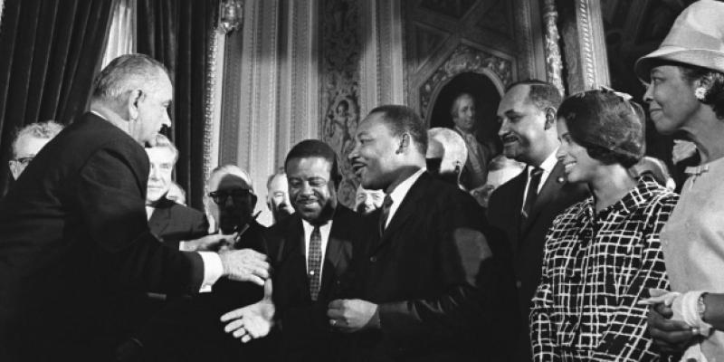 LBJ shakes hands w MLK jr. after signing VRA