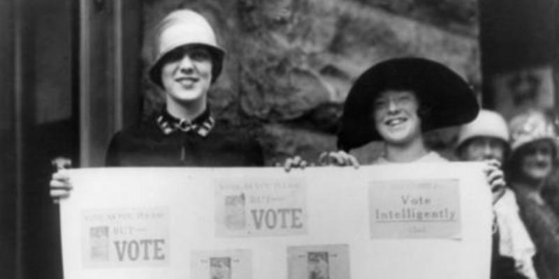 vintage image of women holding signs to Vote