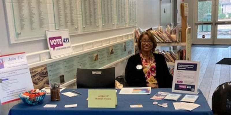 Ida Rowe at info table at Lewes Library