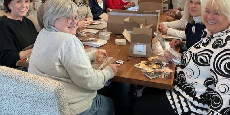 Photo of members working on packets