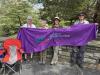 LWVCDC members display banner at Stand Tall for Workers rally