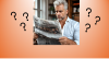mand reading newspaper confused