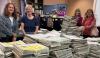 Volunteers package more than 10,000 guides for distribution