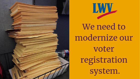 We need to Modernize our Voter Registration System" Pile of voter registration forms. "We need to Modernize our Voter Registration System"