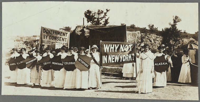 Why Not Now? NY Suffragist displaying the banner "Why Not Now New York?"
