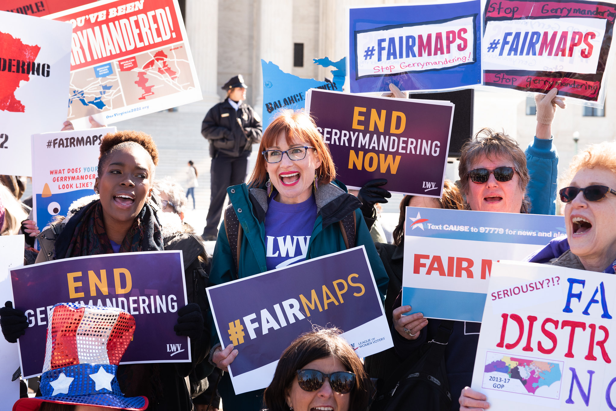 LWV Fair Maps Picture of Leaguers holding signs