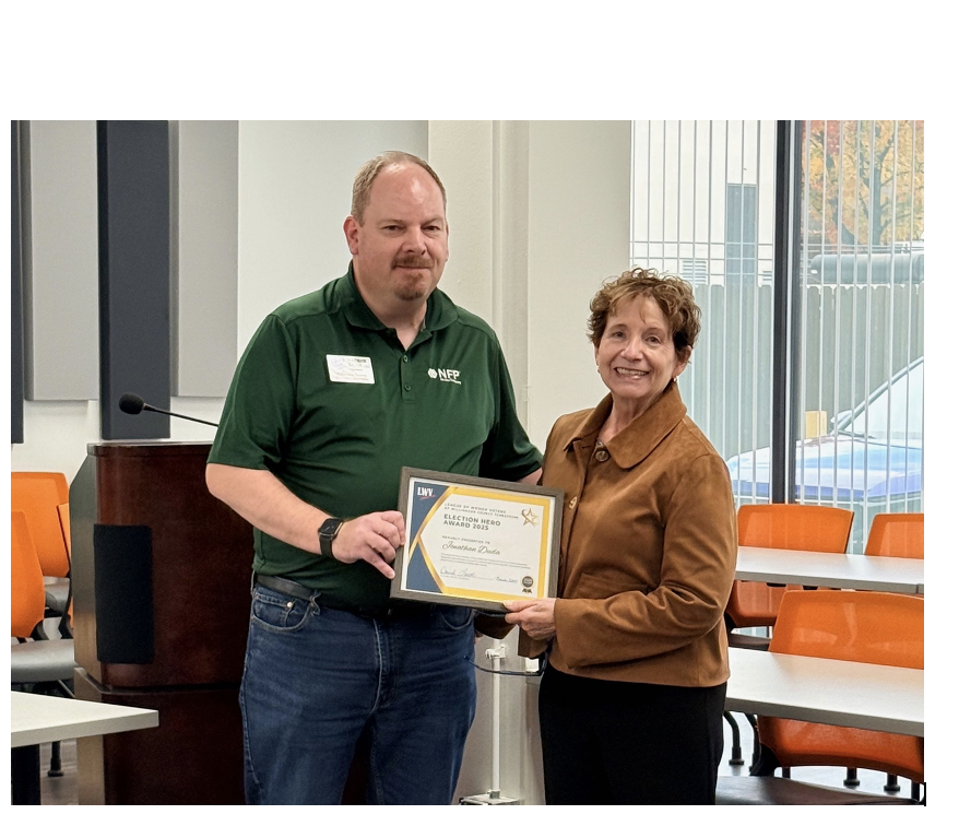Photo of 2 people with award certificate