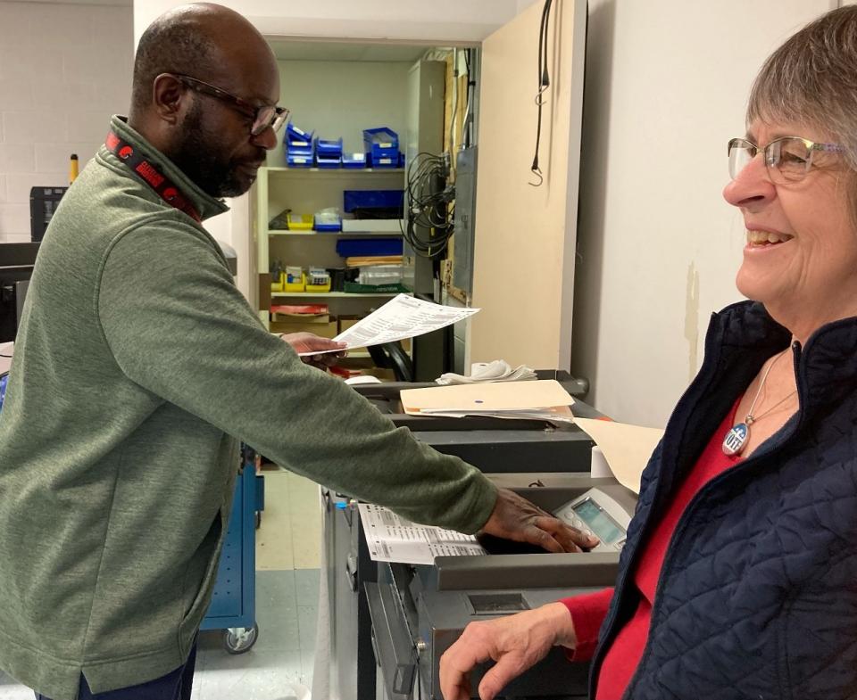 Bev watching voting machine being tested